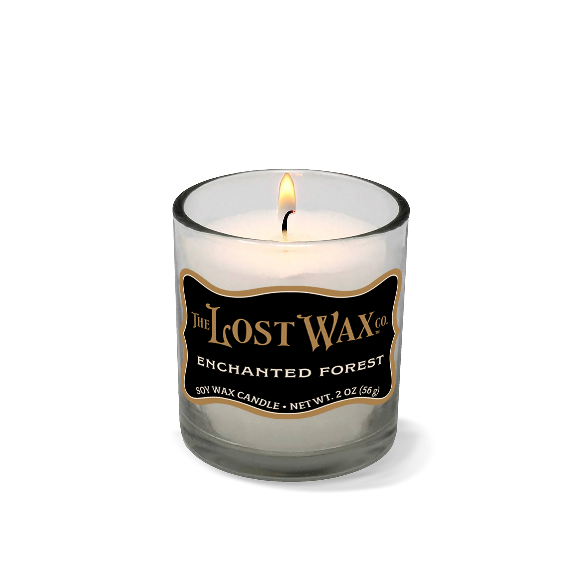 Candle in a glass container with 'The Lost Wax Company' branding on a white background