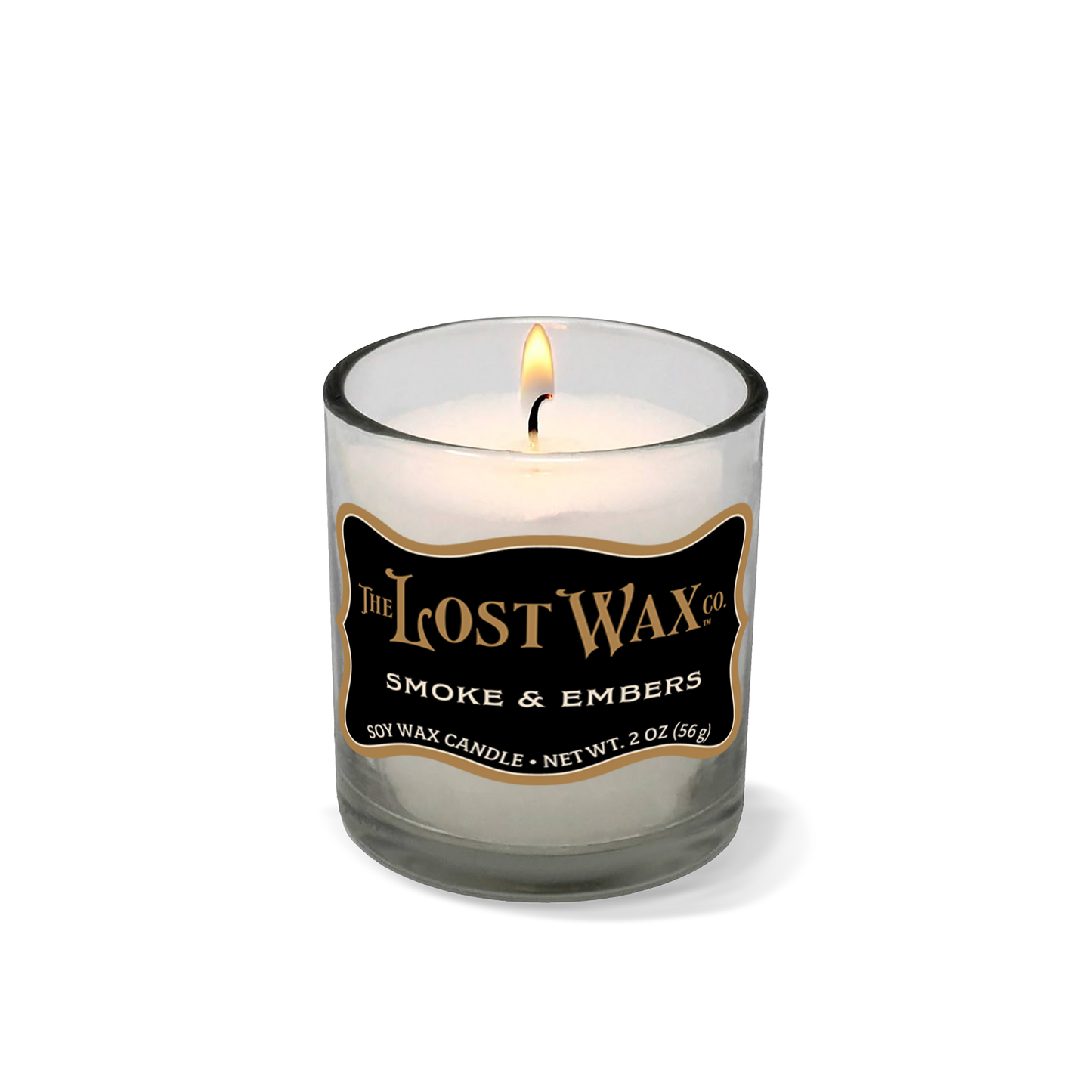Smoke & Embers Votive Candle in a glass jar with 'The Lost Wax Company' branding on a white background