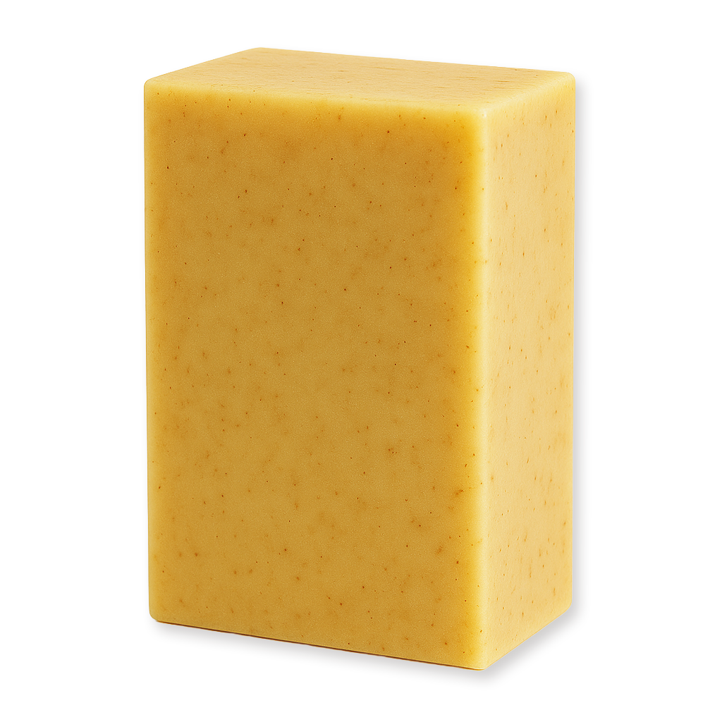A rectangular bar of handmade soap in a warm golden yellow color with tiny brown specks, shown on a plain white background.
