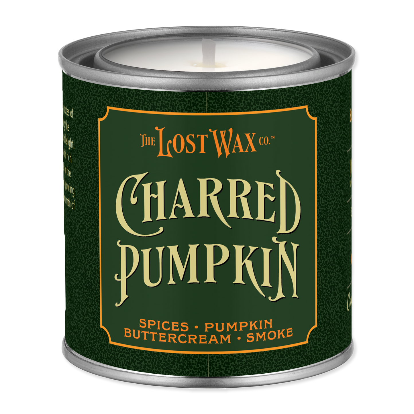 A single-wick candle in a metal tin canister with a dark green label reading 'The Lost Wax Co. Charred Pumpkin' and smaller scent notes 'Spices • Pumpkin • Buttercream • Smoke'.