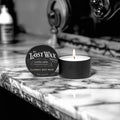 Lost Wax Company candle on a marble surface with vintage background
