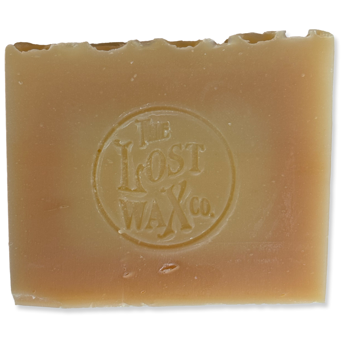 A bar of handmade soap bearing the Lost Wax Co. seal.