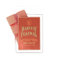 A package of Harvest Festival wax melts by The Lost Wax Co. The product is shown in its clear plastic clamshell packaging with a terracotta red label featuring gold lettering, with two reddish-orange wax melts visible behind it.