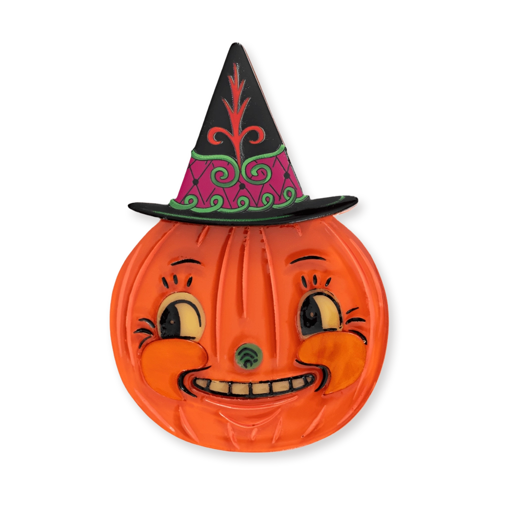 A vintage-style orange jack-o'-lantern Halloween wall decoration with a smiling face and a black witch hat featuring pink, green, and red decorative patterns, shown on a plain white background.