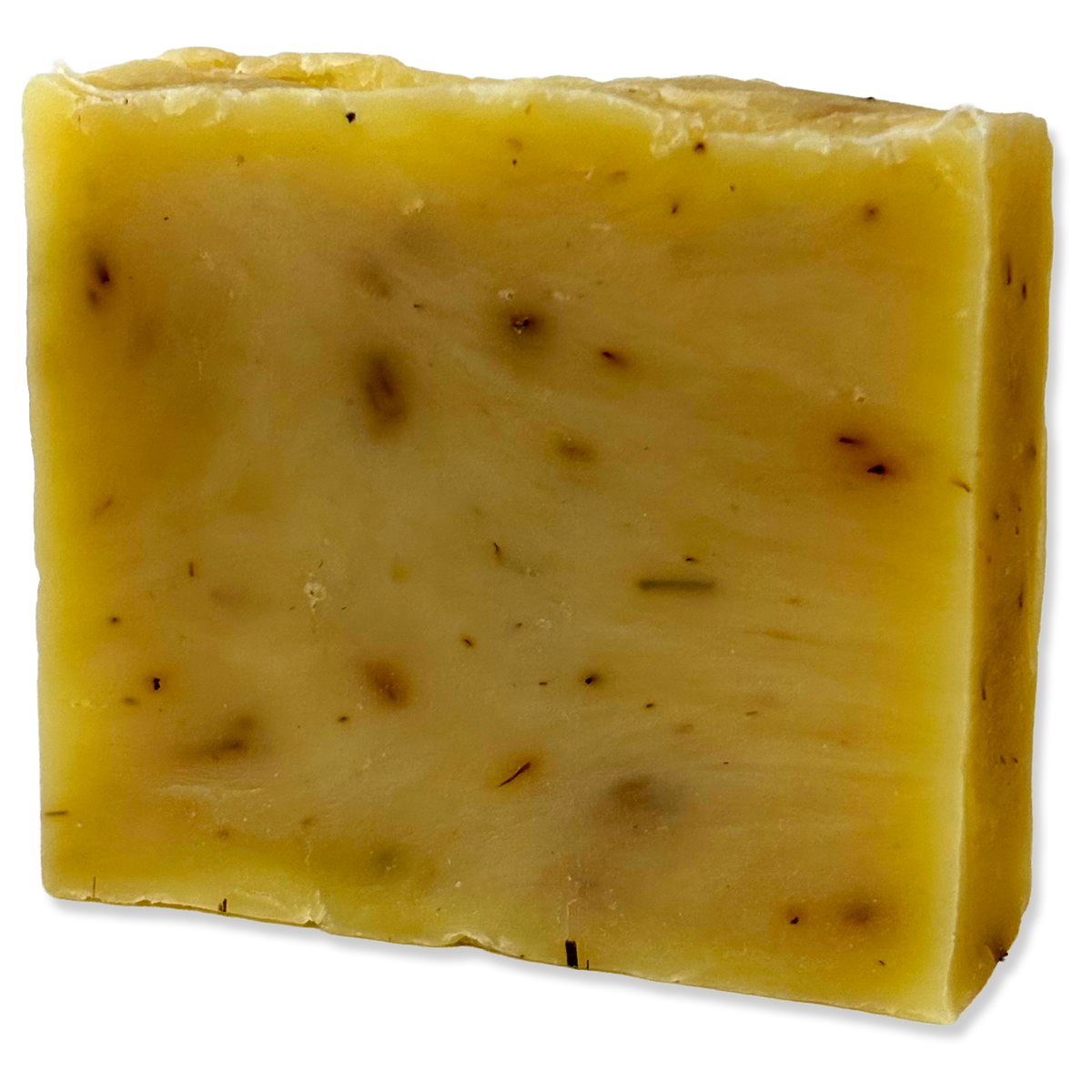 A rectangular bar of handmade soap with a pale yellow color and small dark brown botanical inclusions, shown on a plain white background.