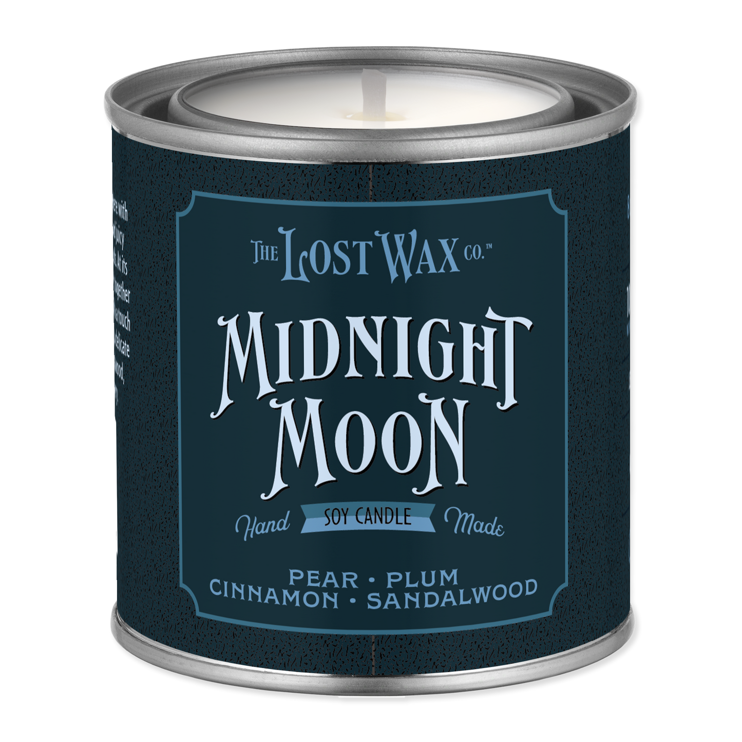 A metal tin candle from The Lost Wax Co. named 'Midnight Moon' in pear, plum, cinnamon, and sandalwood scents, featuring a dark navy blue label with white text.