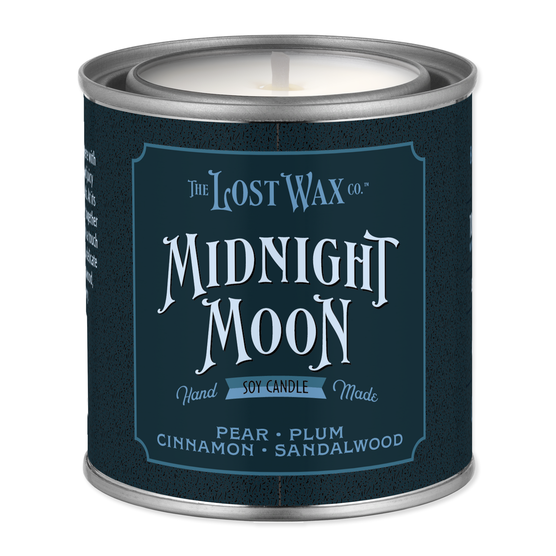 A metal tin candle from The Lost Wax Co. named 'Midnight Moon' in pear, plum, cinnamon, and sandalwood scents, featuring a dark navy blue label with white text.