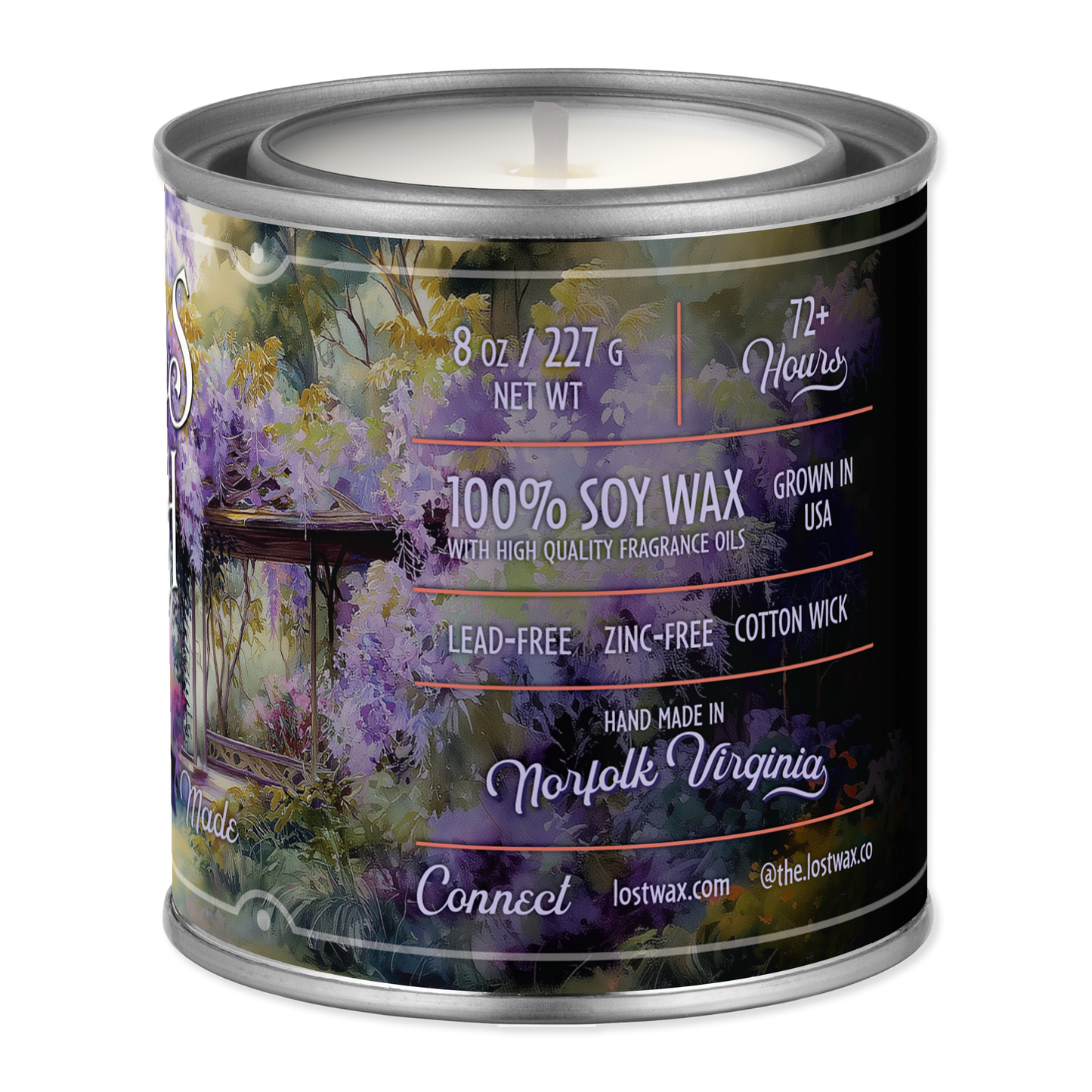 Candle in a tin with a scenic label on a white background