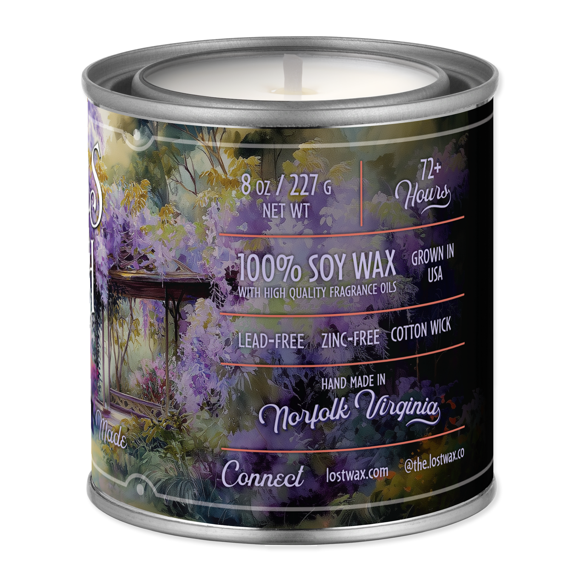 Candle in a tin with a scenic label on a white background