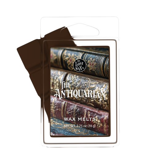 Wax Melt package with 'The Antiquarian' design featuring stacked books on a white background
