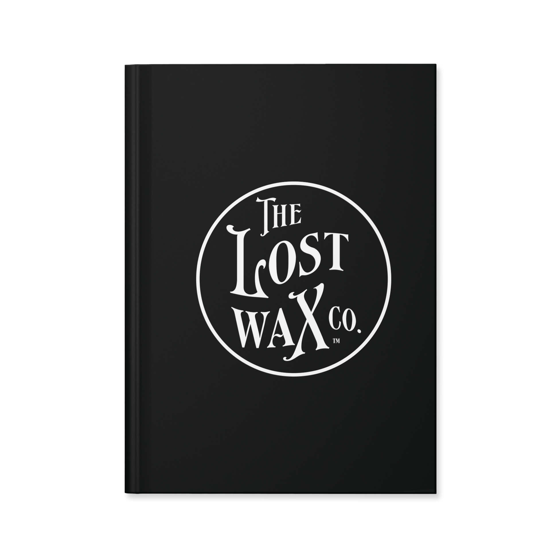 Black notebook journal with white The Lost Wax Co. branding