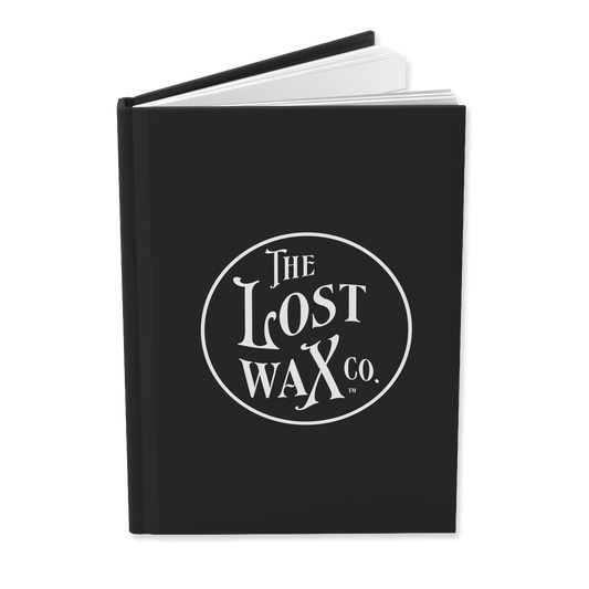 Black journal with The Lost Wax Co. branding