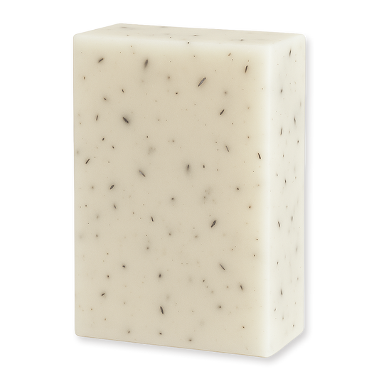 A rectangular bar of creamy off-white soap with small dark flecks embedded throughout, shown on a plain white background.
