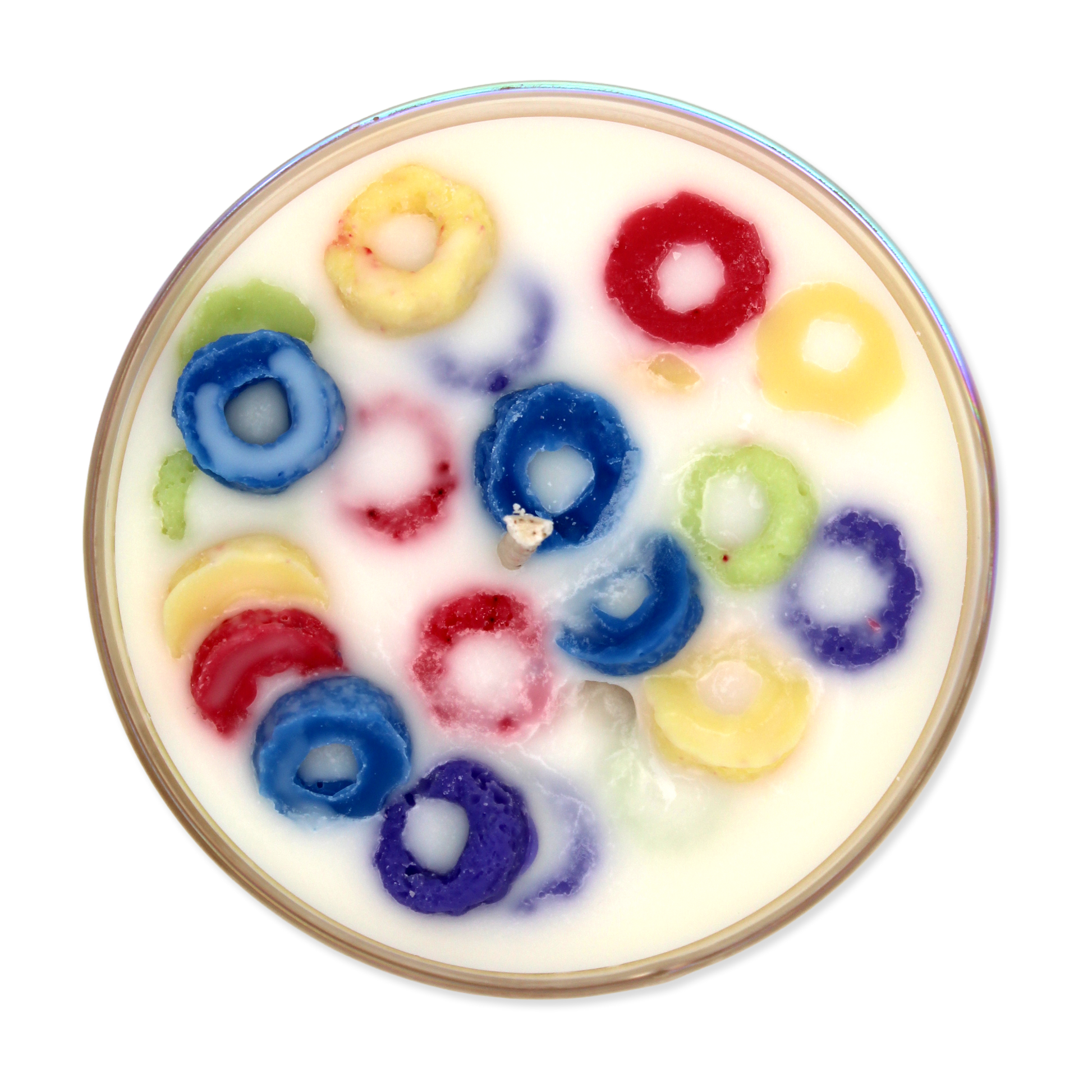 Candle top that looks like colorful cereal loops in a bowl of milk on a white background