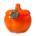 Orange pumpkin-shaped container on a white background
